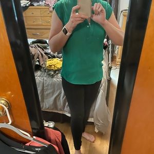 The limited green sleeveless blouse